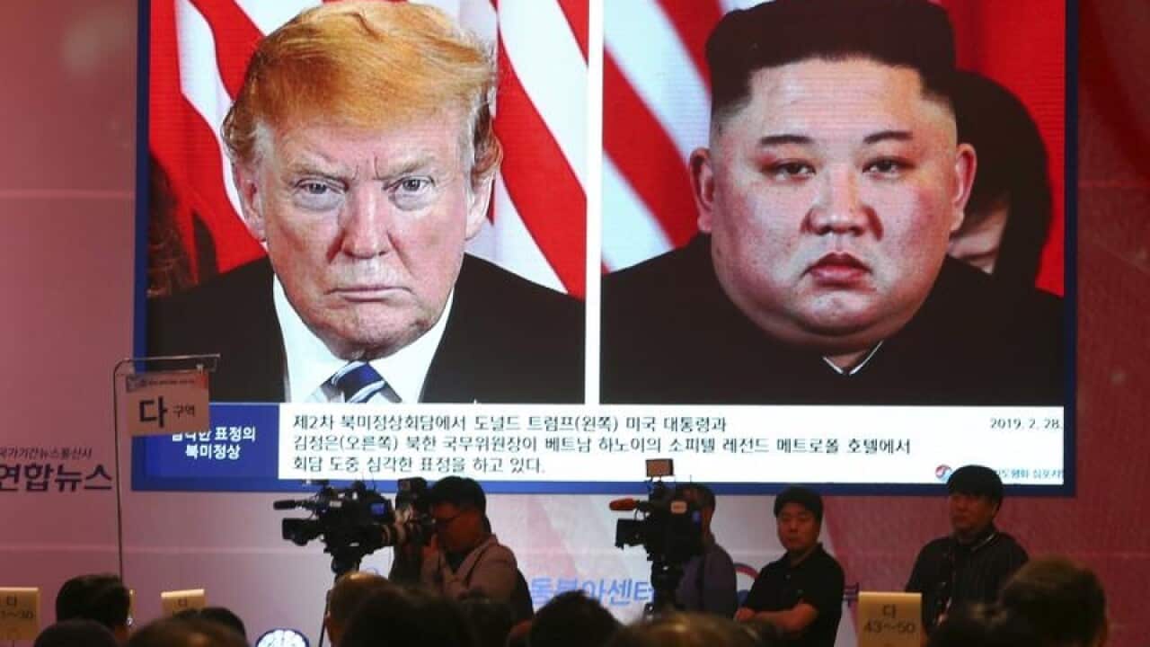 North Korean leader Kim Jong-un (R) and US President Donald Trump