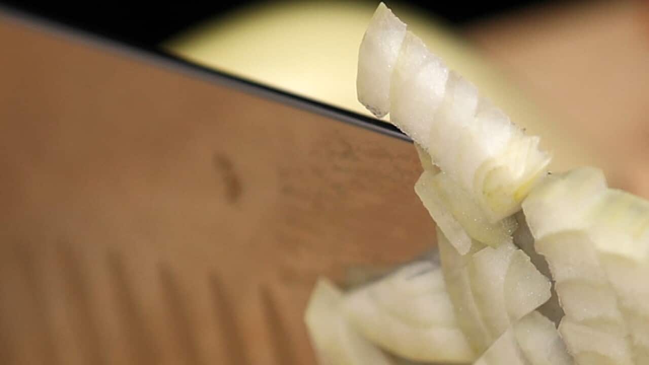 A general view of an onion being cut. Photo credit should read: Tim Goode/PA Wire..