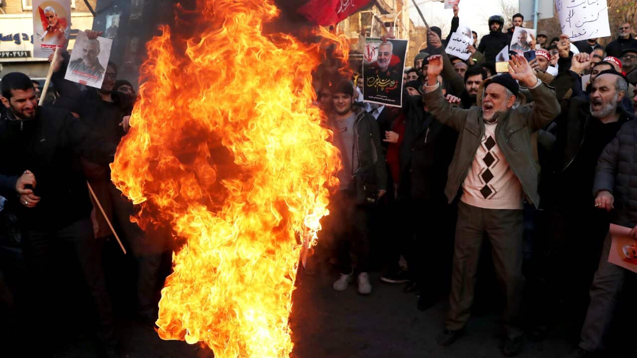 Protesters chant slogans and hold up posters of Qassem Soleimani during a demonstration in front of the British Embassy in Tehran, Iran, 12 January, 2020.