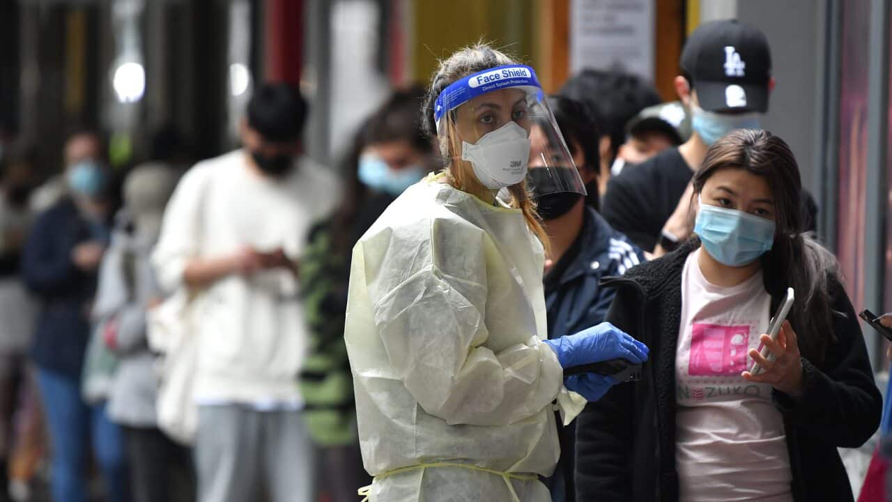 People queue at a walk-in COVID-19 testing site in Melbourne on Wednesday, 5 January 5, 2022.