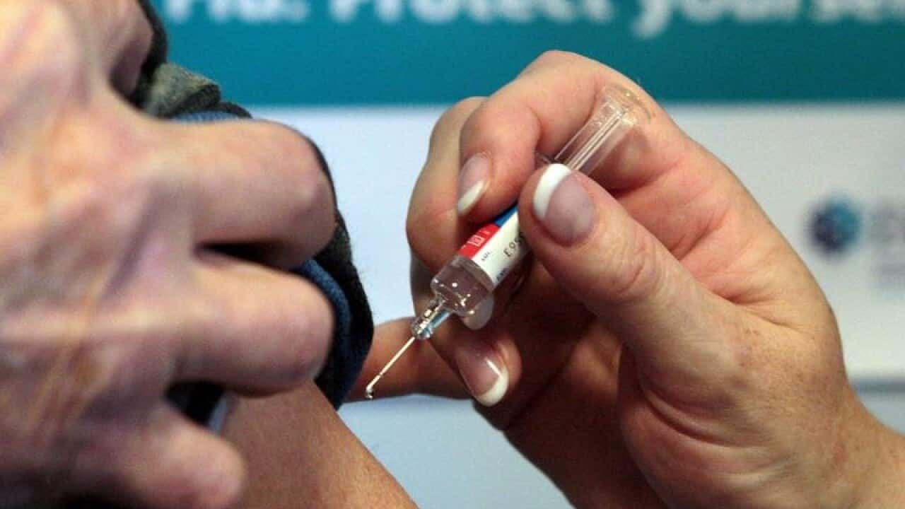 File photo dated 05/10/09 of a person getting a flu jab