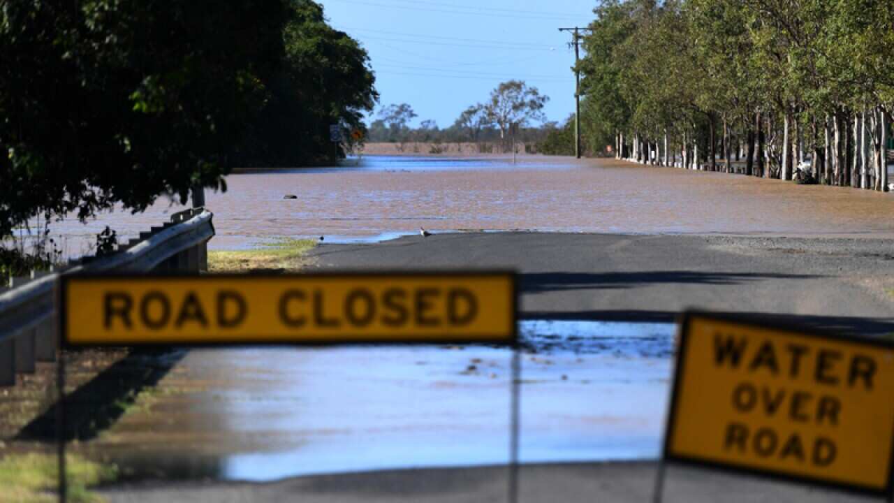 A road is covered by floodwaters in Rockhampton