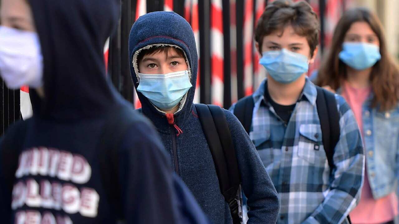 Students wait outside Cassignol College before returning and resuming classes in Bordeaux, France, 18 May 2020.