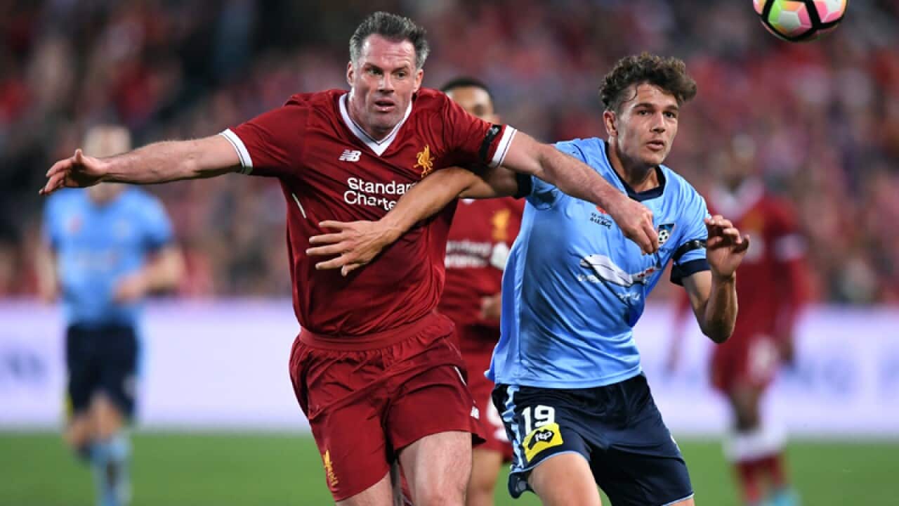 George Blackwood (R) of Sydney FC and Jamie Carragher of Liverpool
