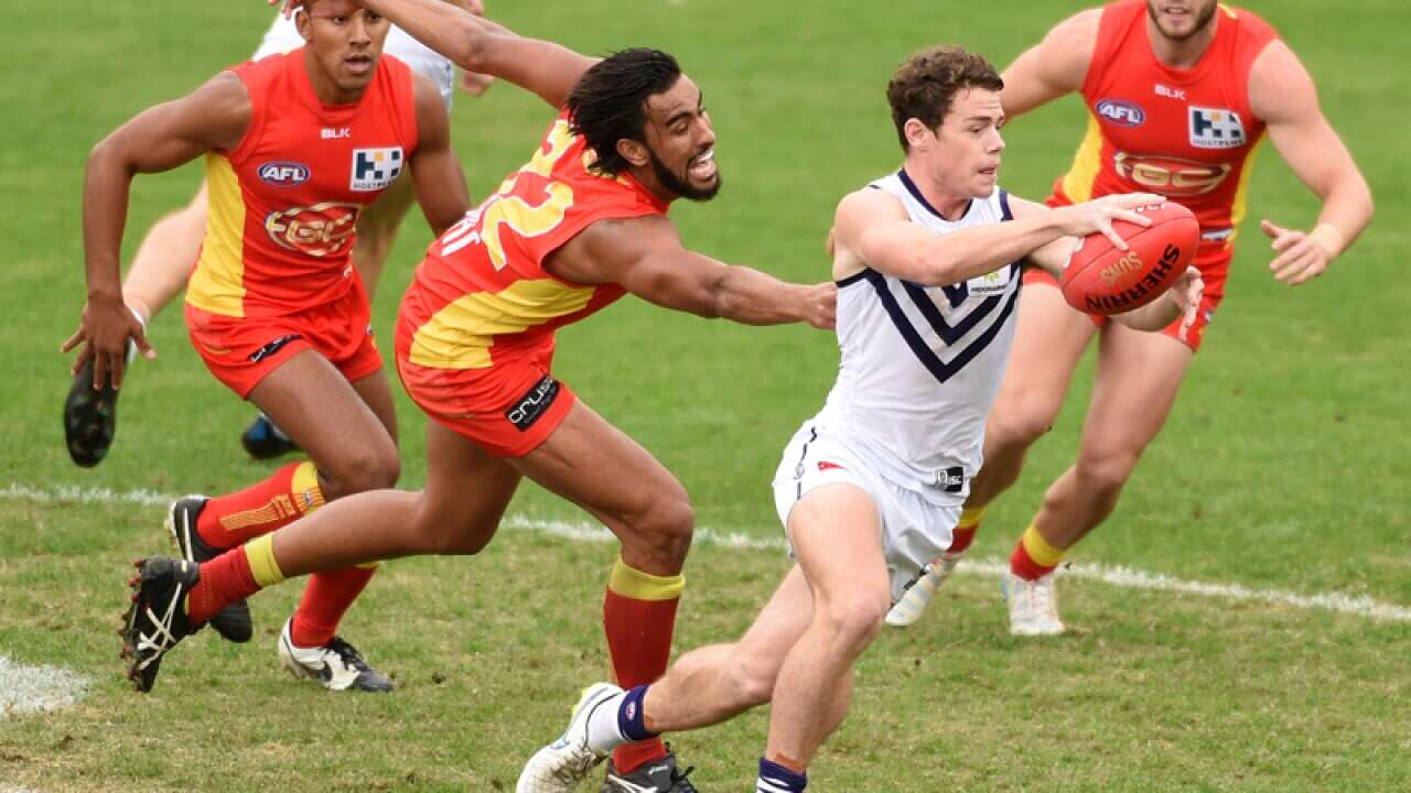 Dockers player Lachie Neale with possession