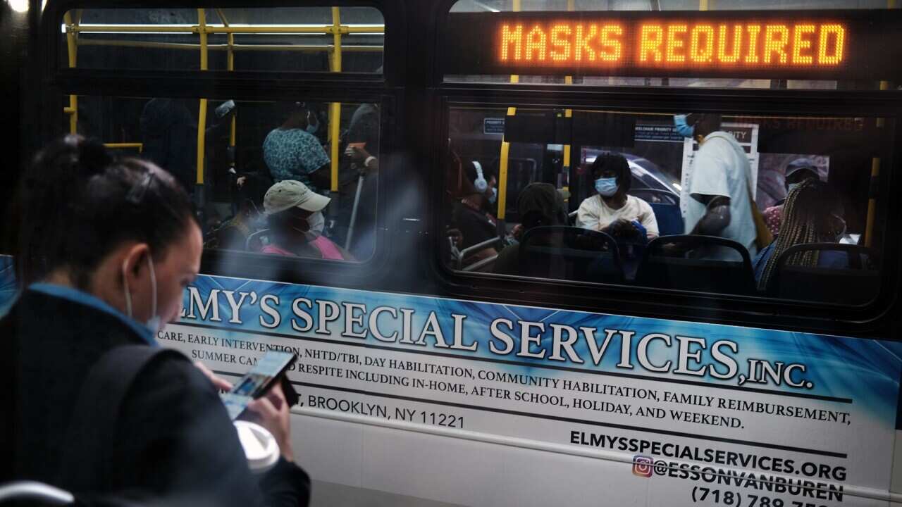 People ride a bus in a Brooklyn, New York City