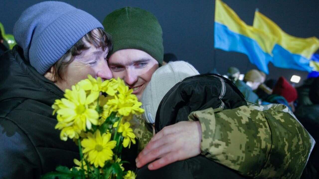 Relatives and friends meet the released Ukrainian hostages at the Boryspil