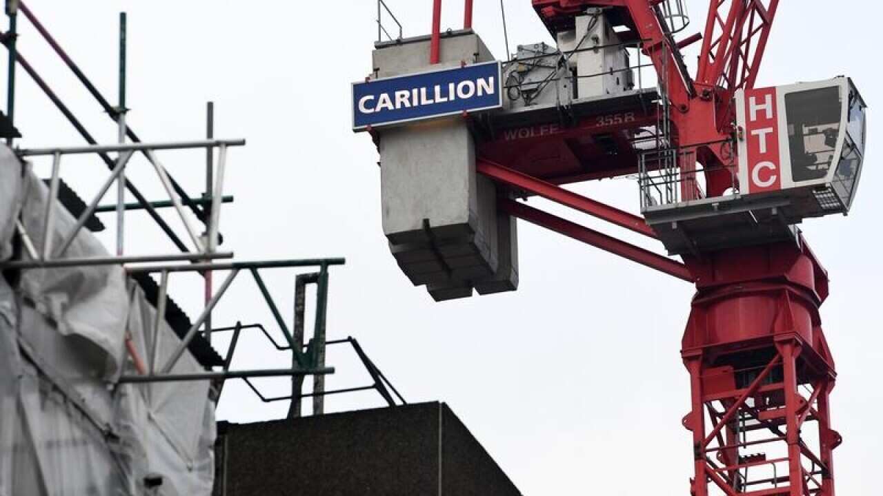 A crane with the logo of the British construction firm Carillion