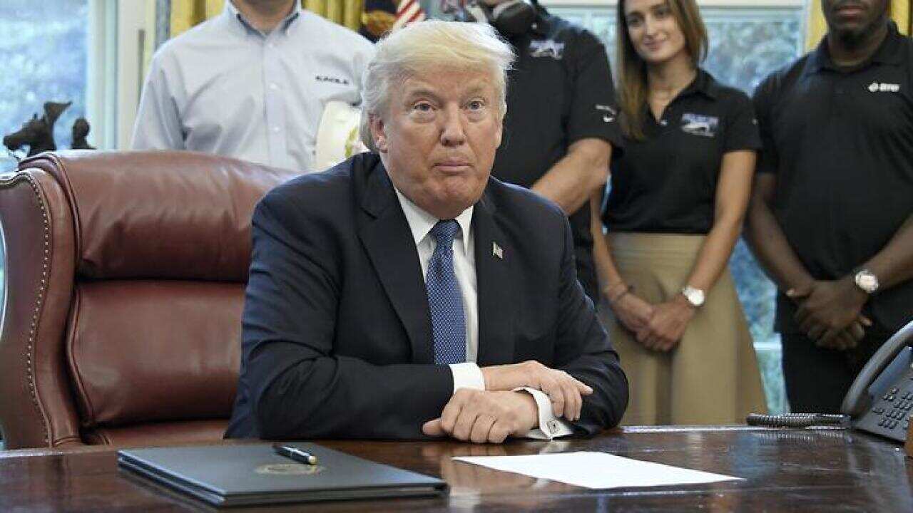 US President Donald J. Trump makes remarks prior to signing the National Manufacturing Day Proclamation in the Oval Office of the White House in Washington, DC, USA, 06 October 2017. EPA/Ron Sachs / POOL
