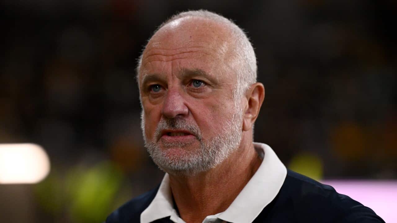 Graham Arnold on football field