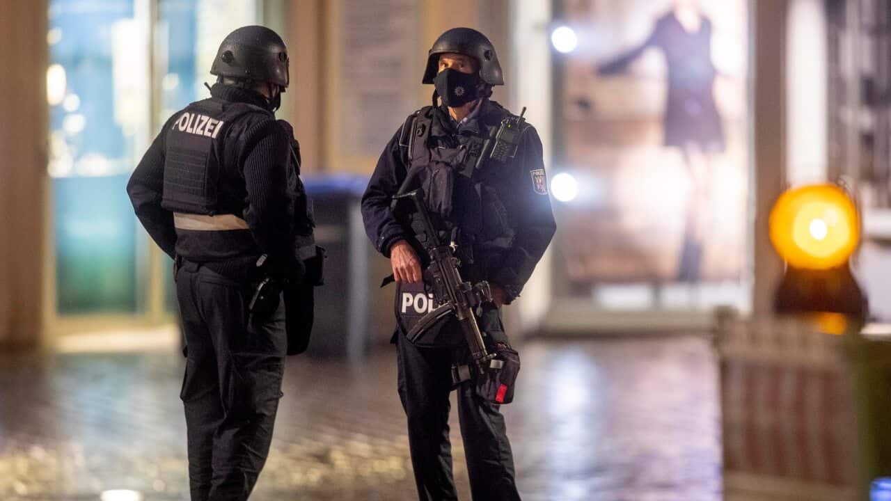 Police officers guard evidence at the scene of an incident in Trier, Germany, Tuesday, 1 December, 2020.