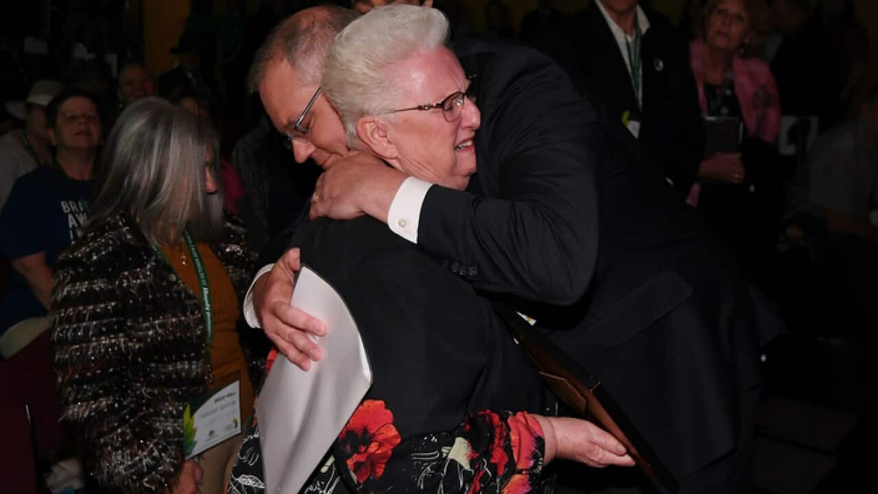 Prime Minister Scott Morrison hugs a child-abuse victim