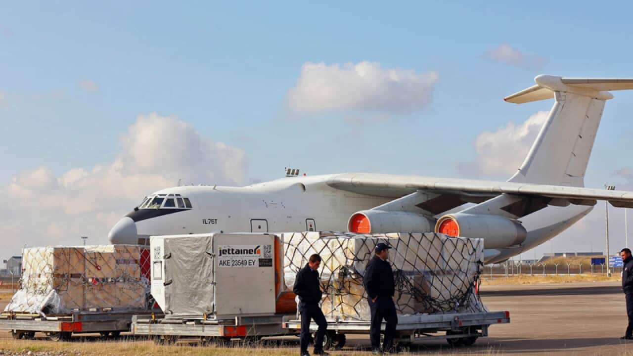 Humanitarian aid is loaded onto a plane in Iraq