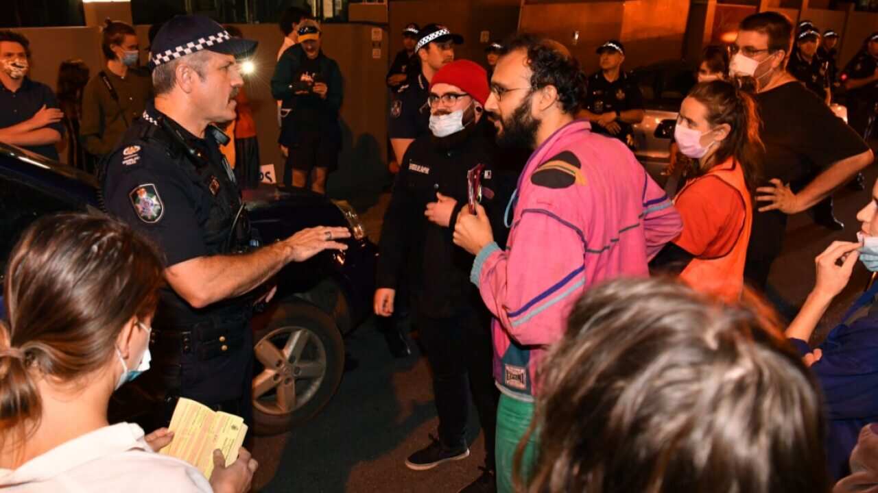 Protesters are staging a blockade to prevent the removal of asylum seekers who have been detained in the makeshift Brisbane immigration detention site.
