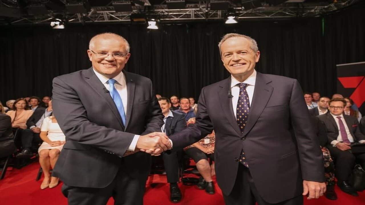 Scott Morrison and Bill Shorten shake hands before their debate.