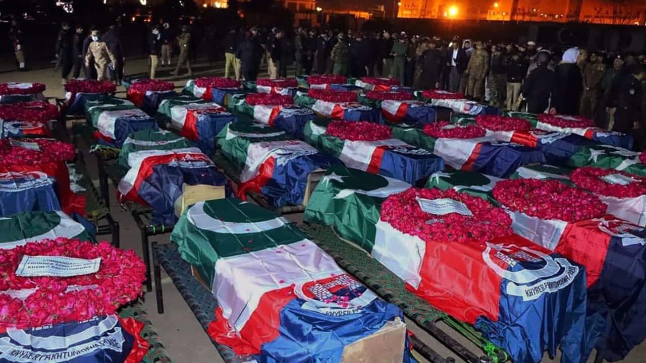 Security officials gather for funeral prayers of police officer killed in the Peshawar bombing