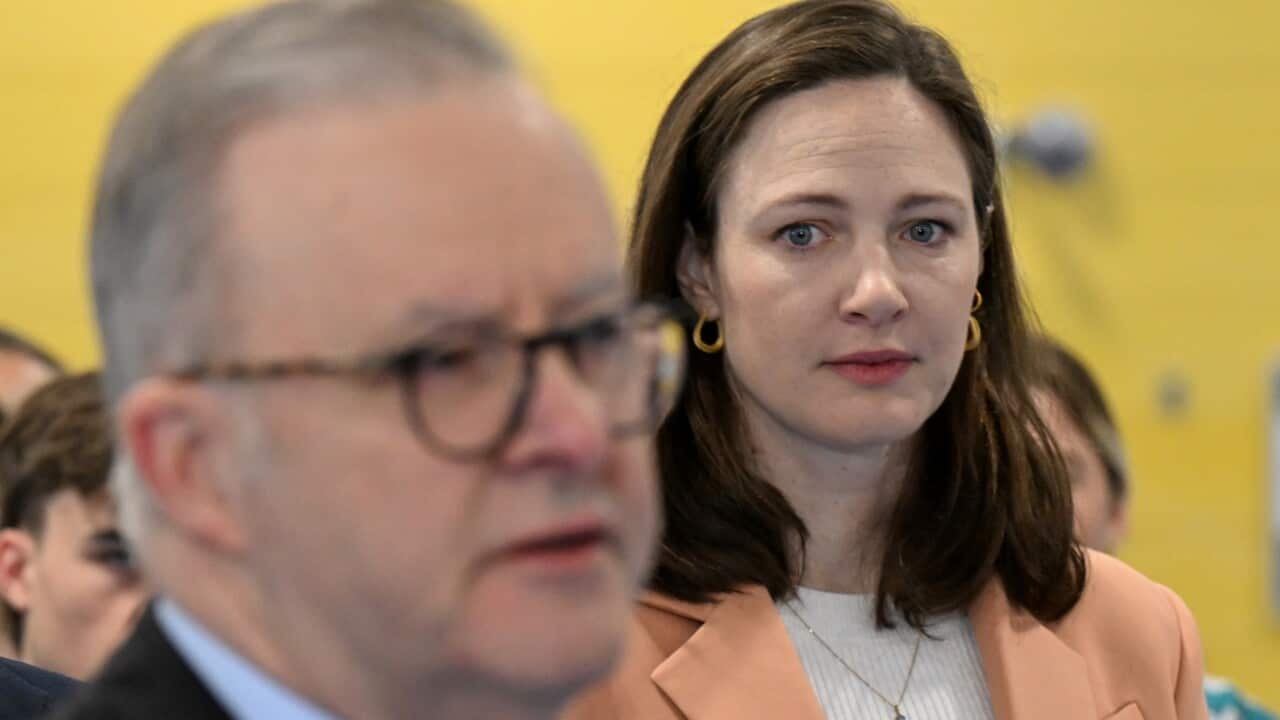 Retired Olympic swimmer Cate Campbell listens to Australian Prime Minister Anthony Albanese during a visit to the Australian Institute of Sport, Canberra.