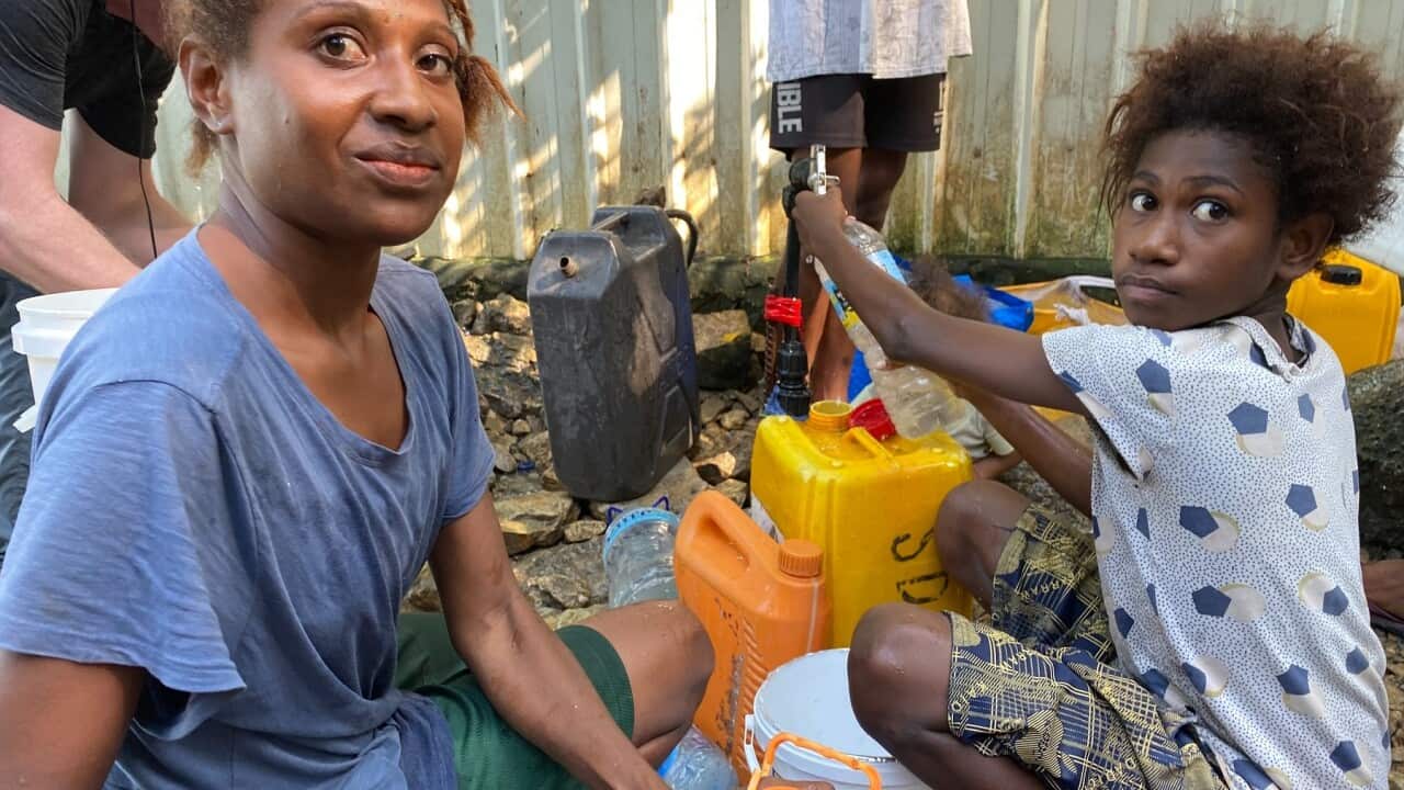 Children collect drinking water in Port Moresby (Stefan Armbruster, SBS).jpg
