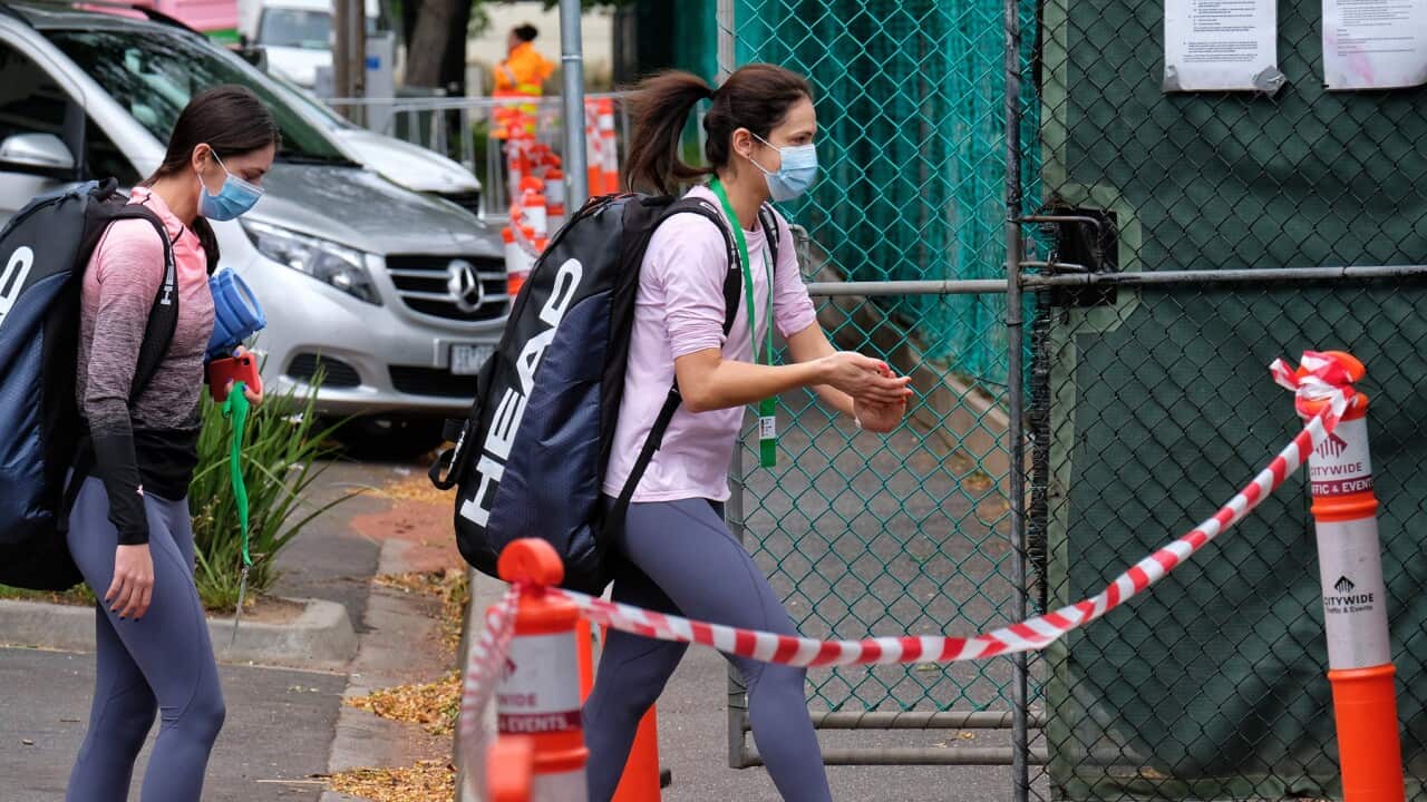 Tennis players are escorted to training on Monday
