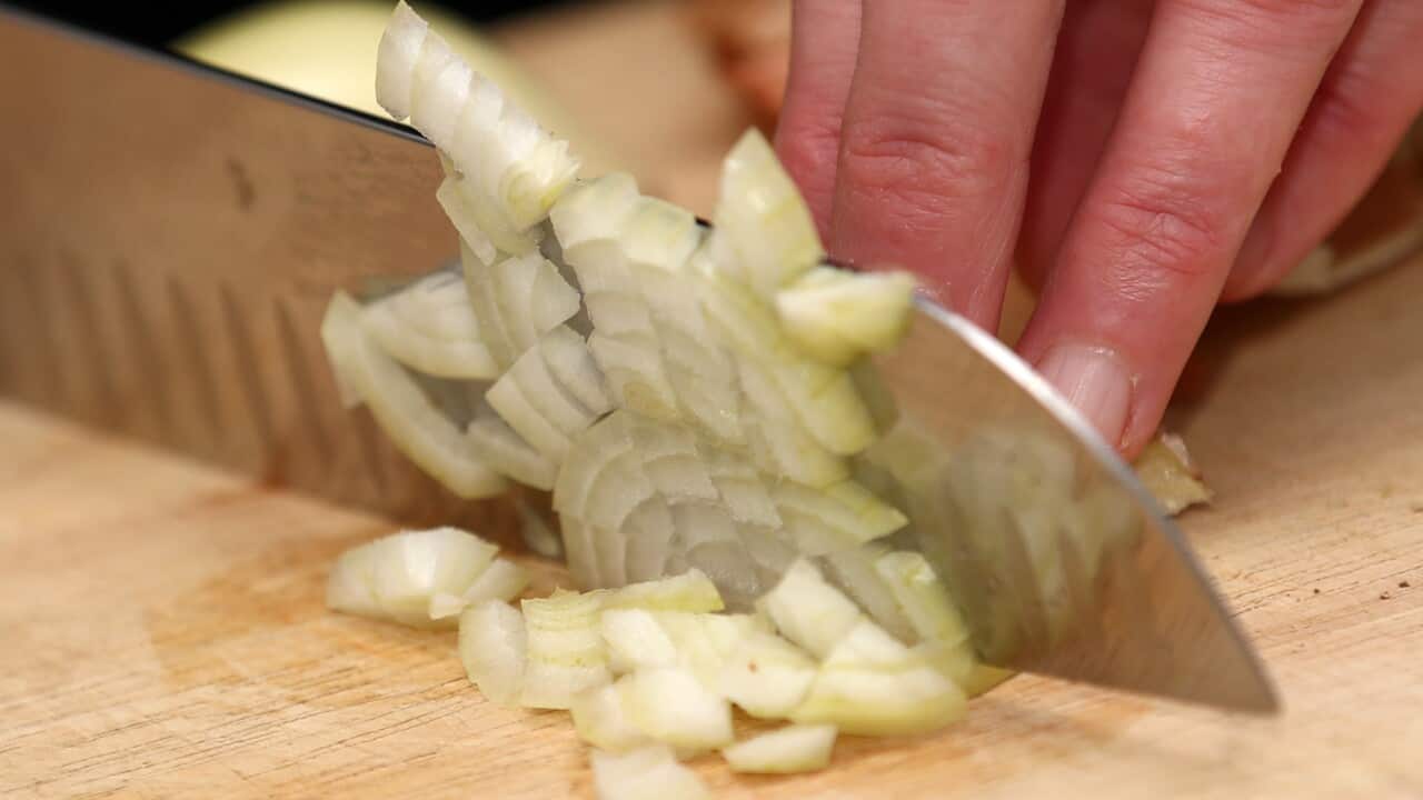 A general view of an onion being cut. Photo credit should read: Tim Goode/PA Wire..