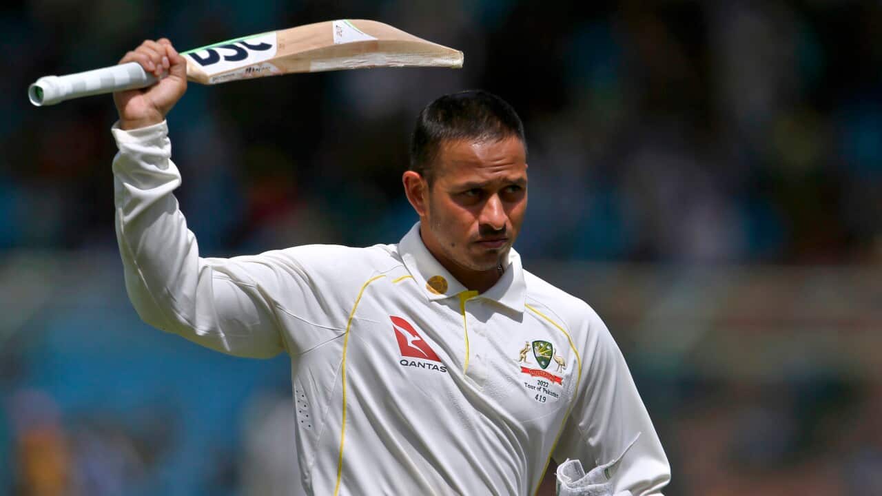 Australia's Usman Khawaja raises his bat