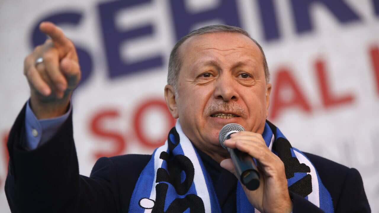 Turkey's President Recep Tayyip Erdogan gestures as he delivers a speech at a rally of his ruling Justice and Development Party's (AKP) in Istanbul.