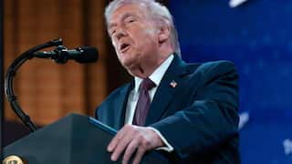 Donald Trump speaking at podium