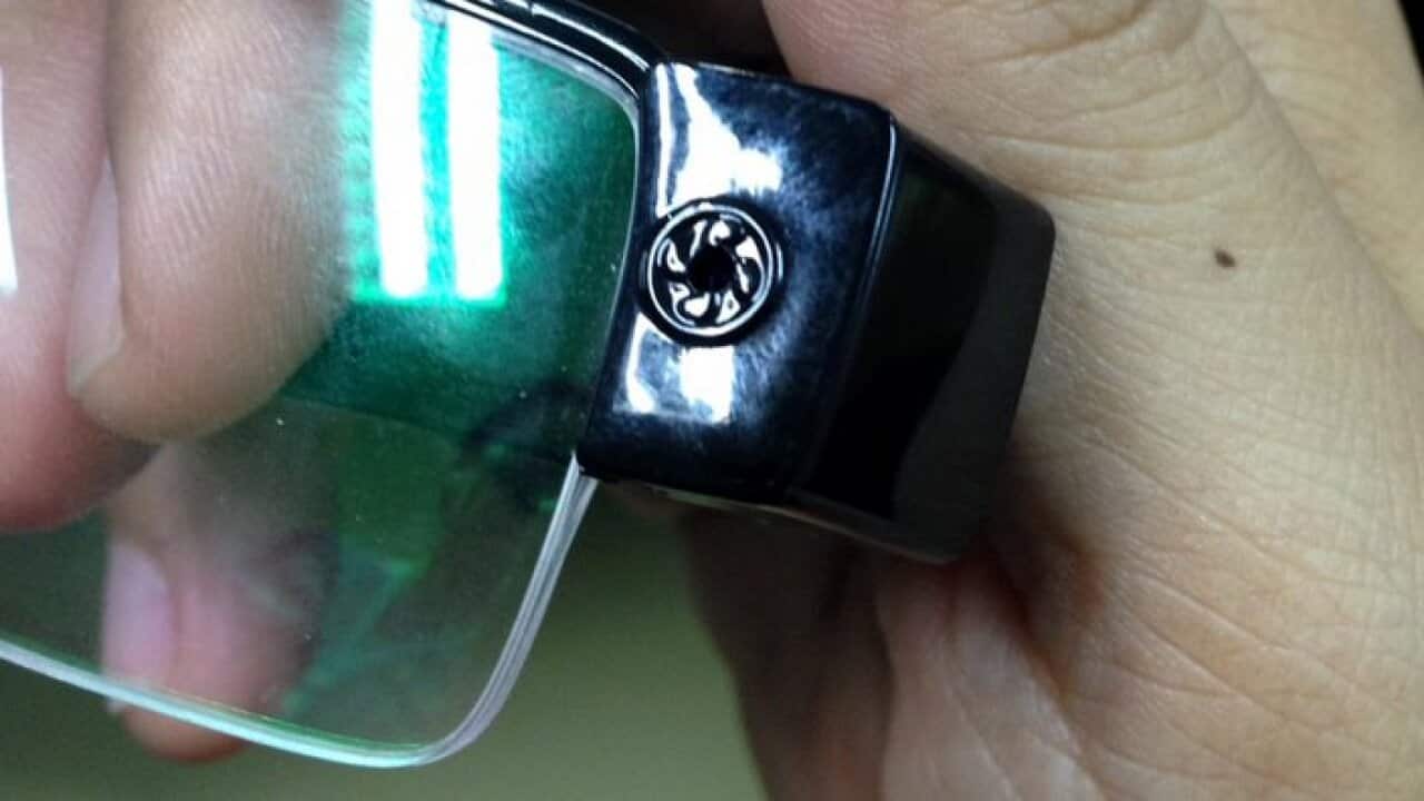 shows a set of glasses with a hidden camera used by students