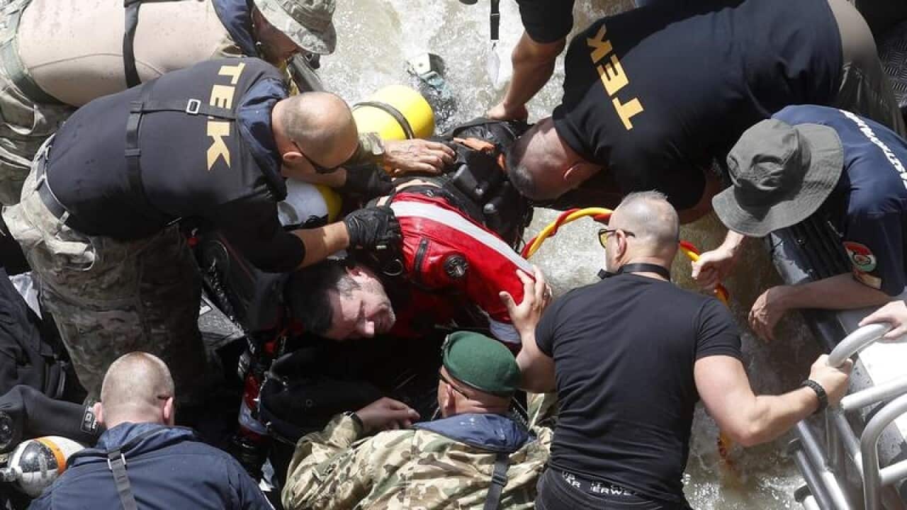 A rescue diver gets out from a Danube River