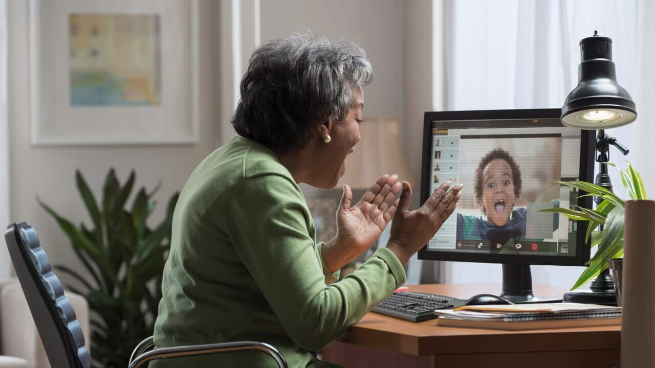 Granny talking to her grandchild oniine