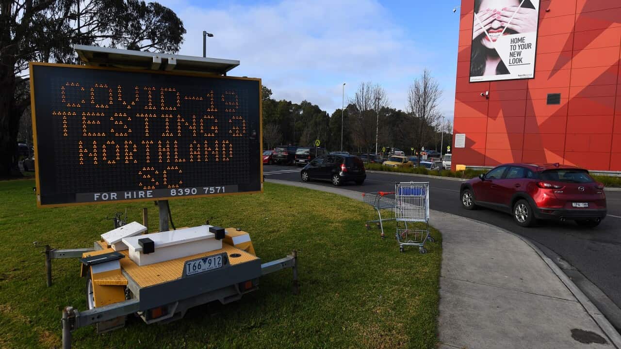 Signage for a COVID-19 testing facility is seen at Northland shopping centre in Melbourne