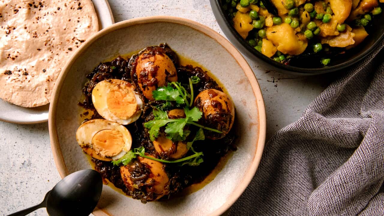 Eggs in tamarind gravy with potatoes and peas (Khatteh ande with aloo matter sabzi)