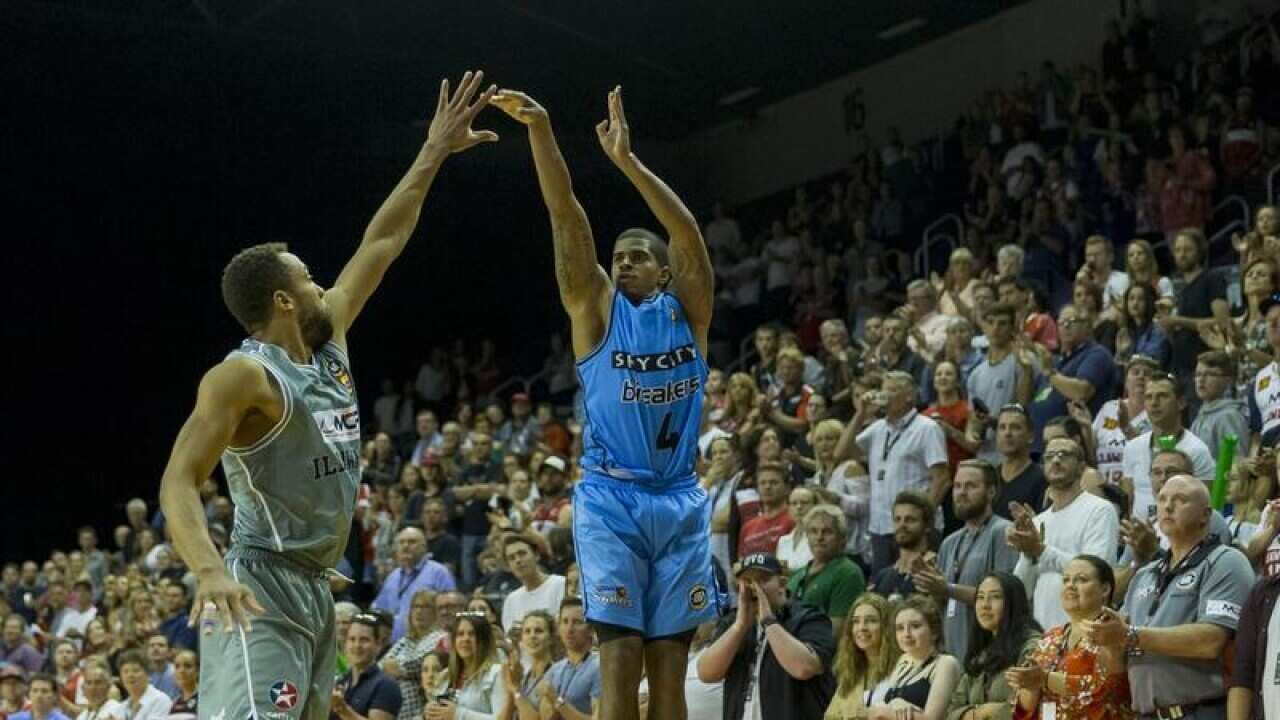 Edgar Sosa of the Breakers (right) shoots