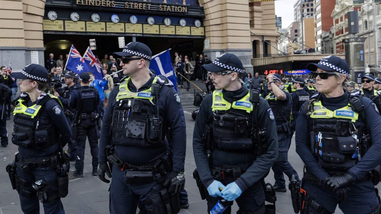 Police in Melbourne at Flinders Street Station.