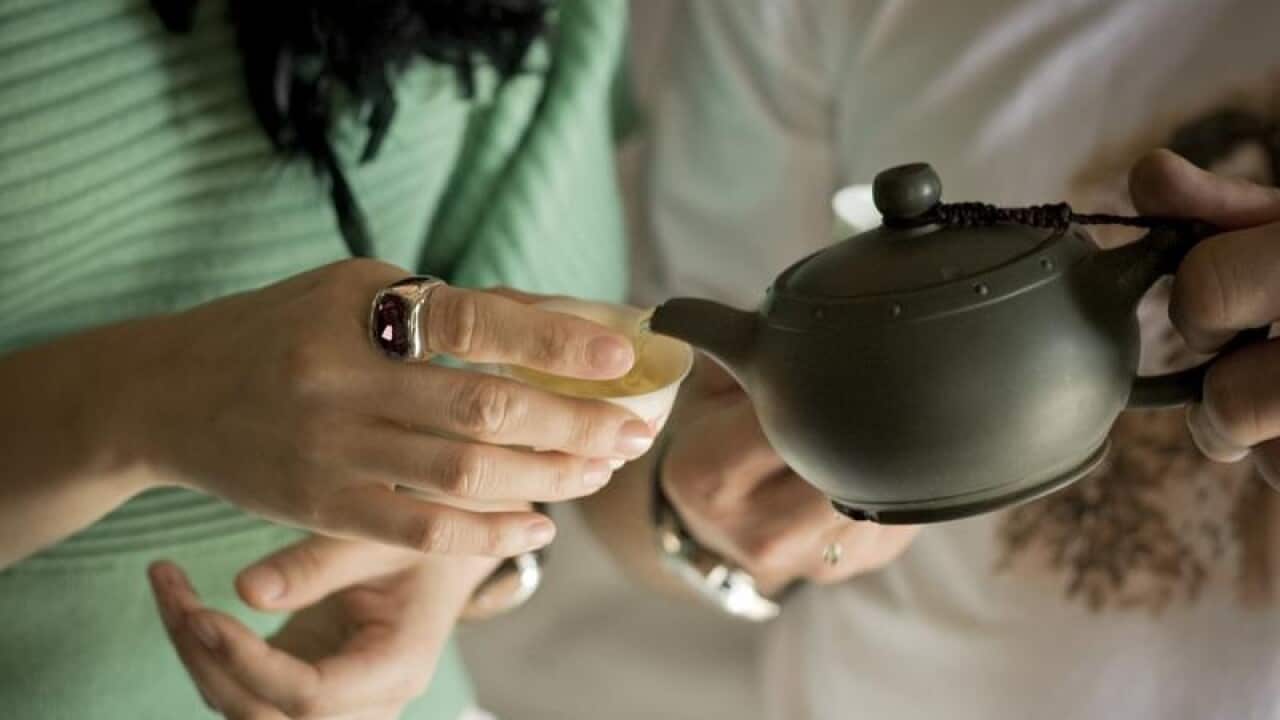A cup of tea being poured