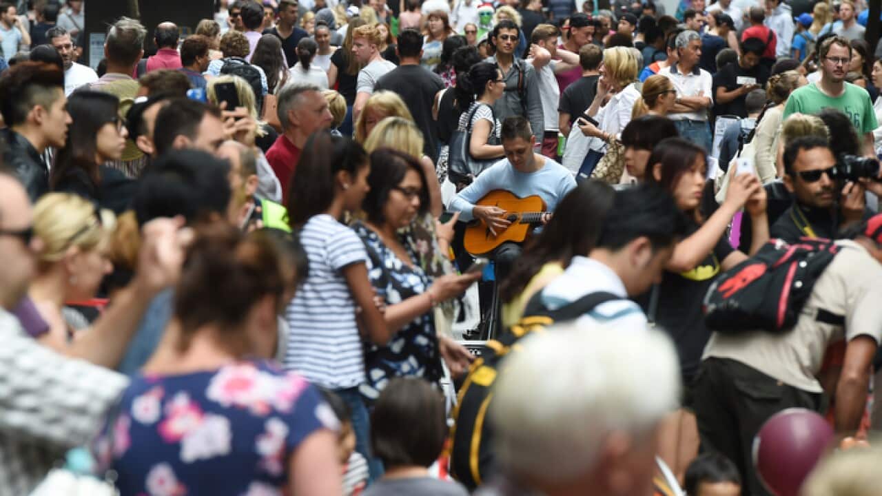 Huge crowds fill Pitt Street Mall and the CBD shopping district as they purchase their last minute christmas gifts on Christmas Eve in Sydney, Wednesday, Dec. 24, 2014. (AAP Image/Dean Lewins) NO ARCHIVING