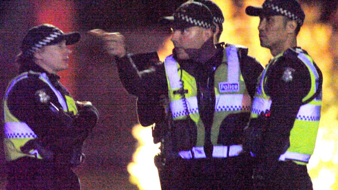Victoria Police officers during a siege in Melbourne
