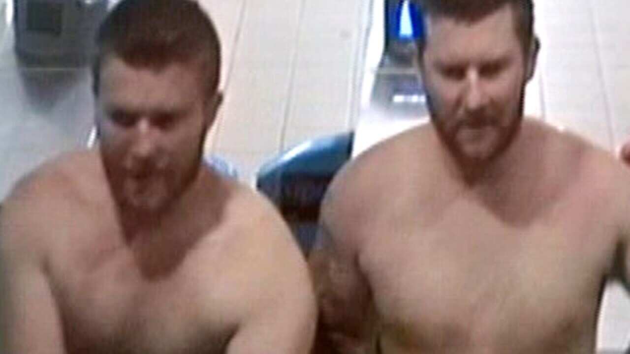 Two men wanted by NSW police over an assault on a train