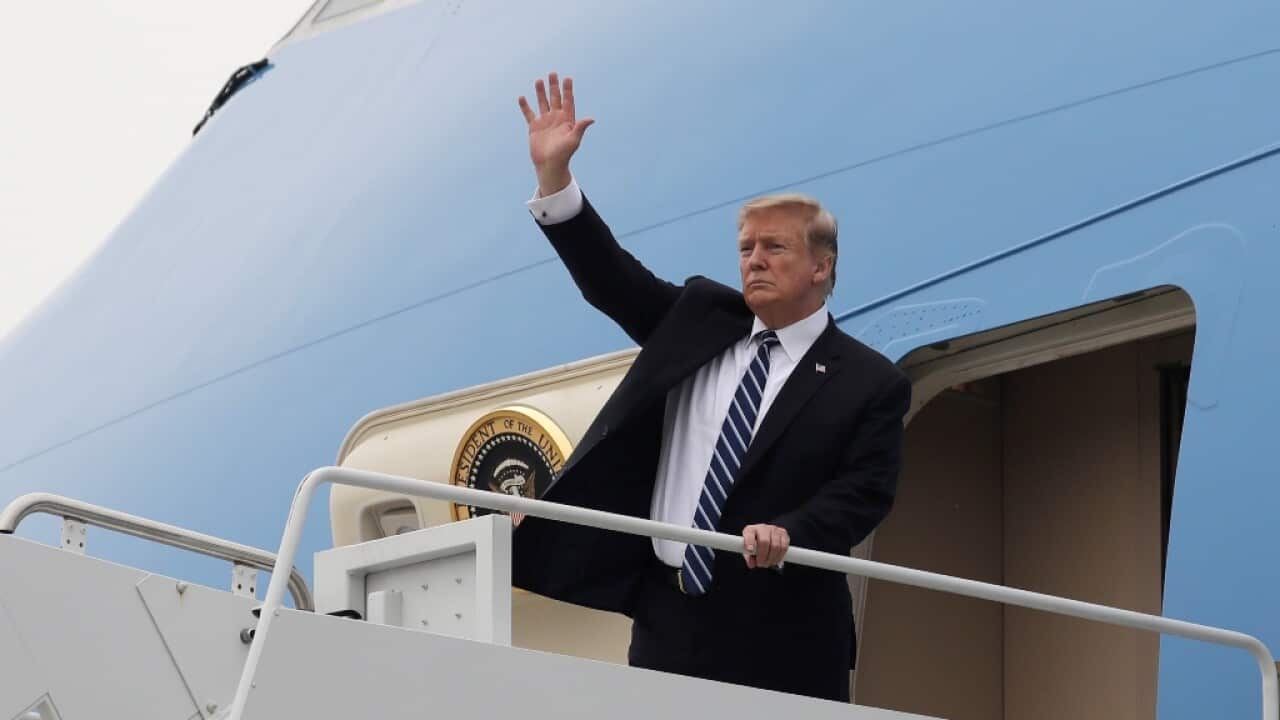 Donald Trump waves as he boards Air Force One in Vietnam after attending a summit with North Korean leader Kim Jong-un