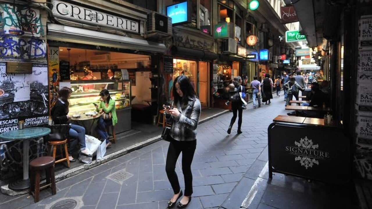 Pedestrians walk in Degraves Street in Melbourne