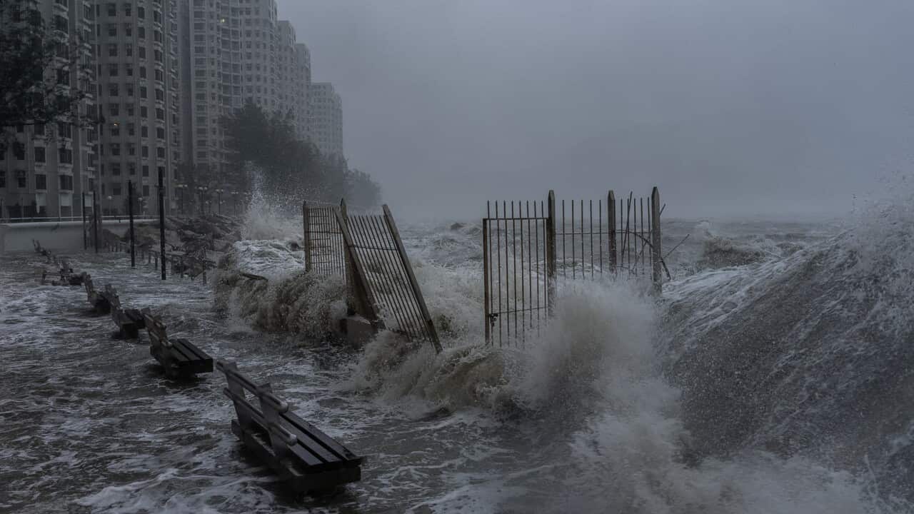 Strong waves crash against the waterfront in Hong Kong's Heng Fa Chuen area as Super Typhoon Ragasa approaches.