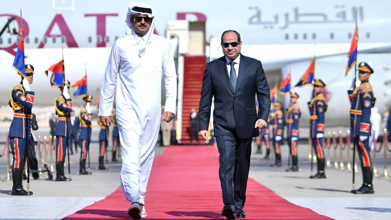 Egyptian President Abdul Fattah al-Sisi (R) receiving Qatari Emir Emir Sheikh Tamim bin Hamad Al Thani in Cairo, Egypt (AAP)