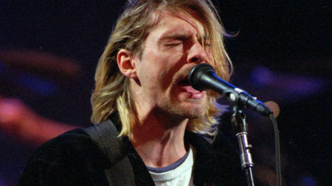 Late Nirvana frontman Kurt Cobain performs.