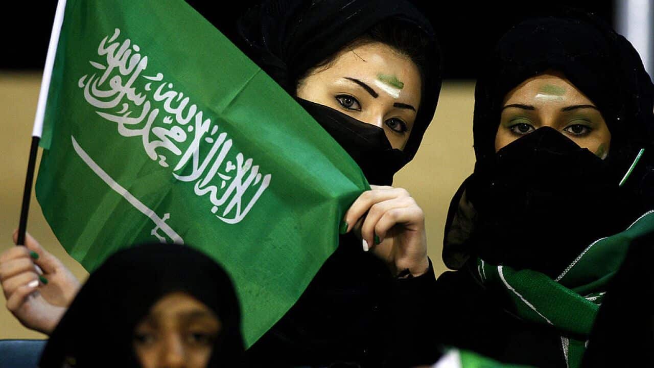 Veiled female Saudi football fans