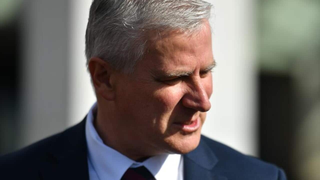 Deputy PM Michael McCormack is seen talking to students.