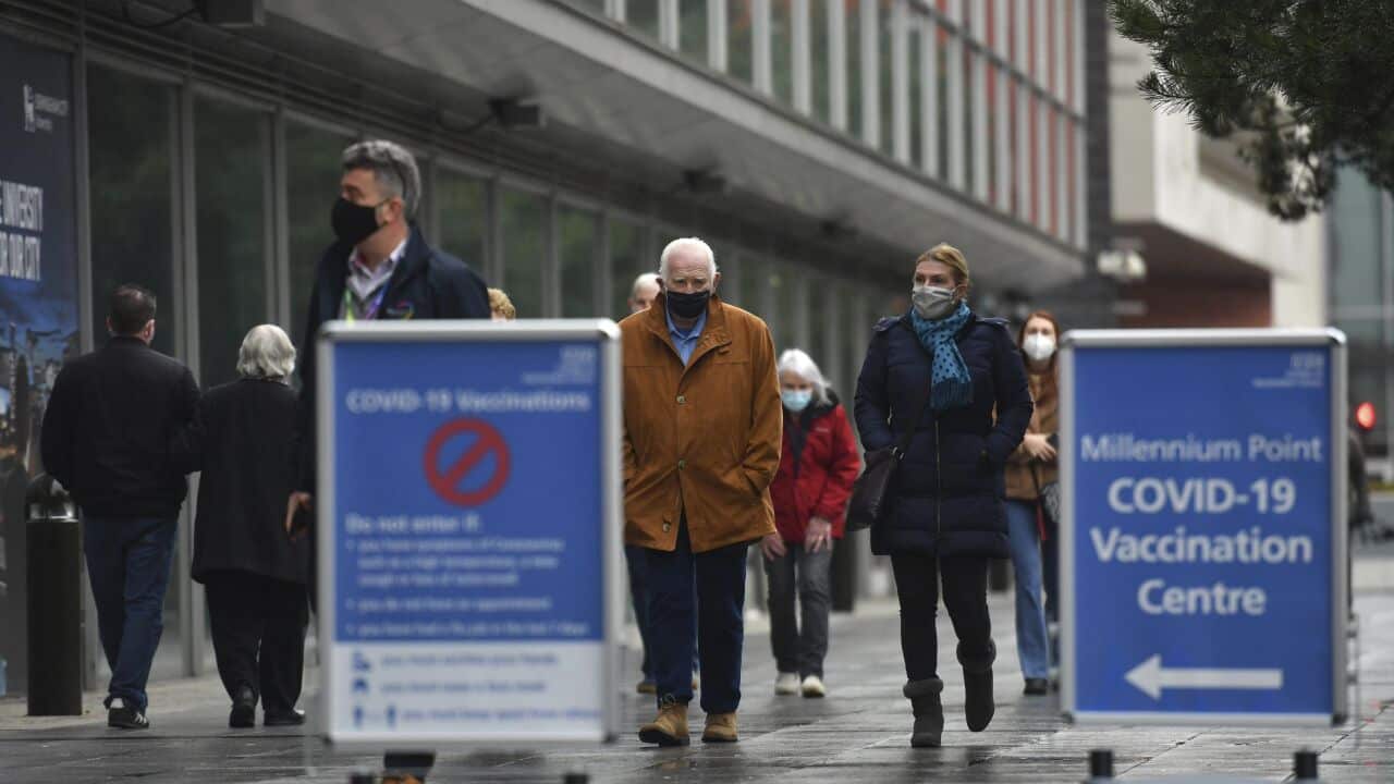 People arrive for their injection at an NHS vaccine centre in Birmingham