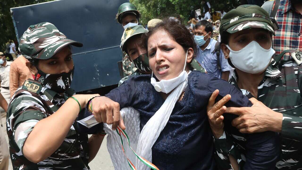 Indian police personnel detain Indian Youth Congress activists as they protest against the central government in New Delhi, India, 05 August 2021.