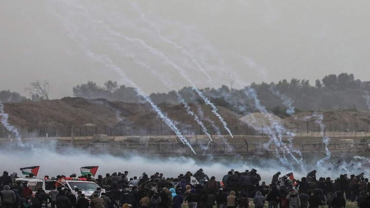 Tear gas is fired at Palestinian protesters
