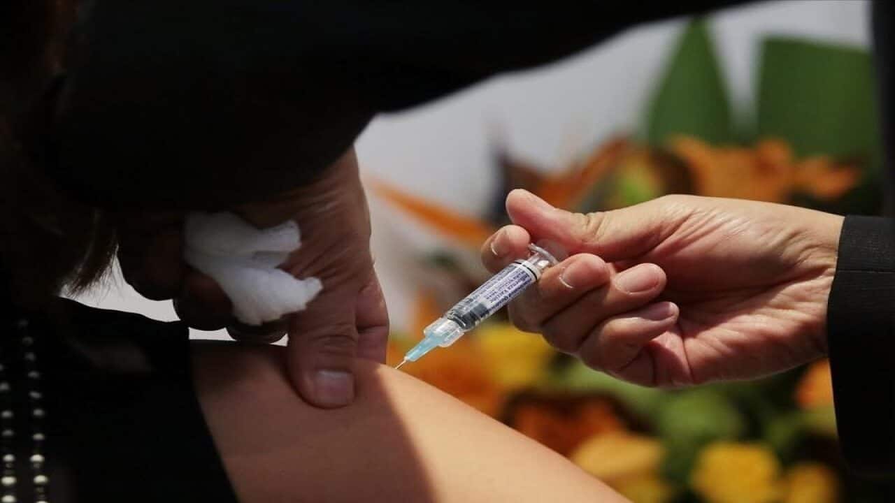 A member of the public receives a flu shot