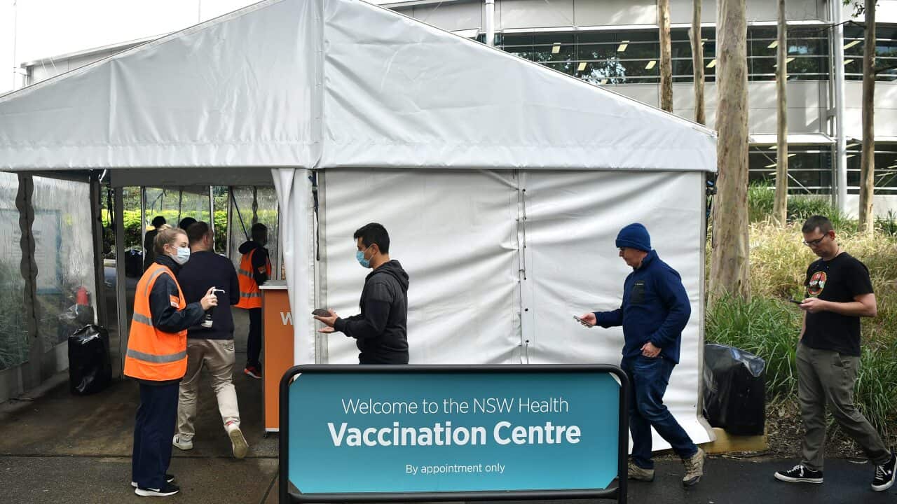 Members of the public wait for a vaccine at a mass COVID-19 vaccination hub in Sydney.